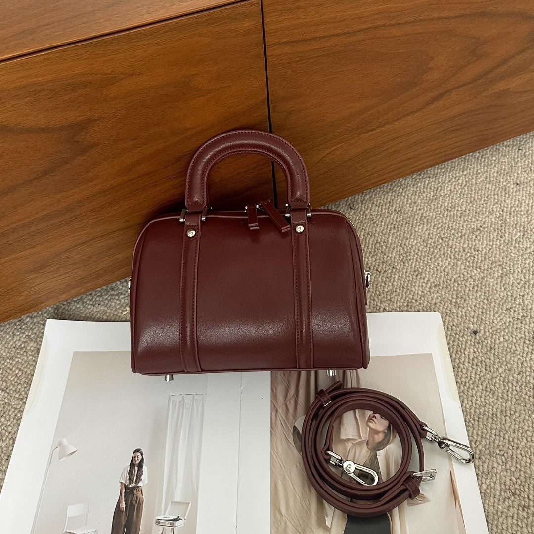 versatile cylindrical genuine leather portable crossbody bag