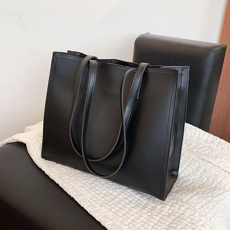 a versatile portable commuter tote bag