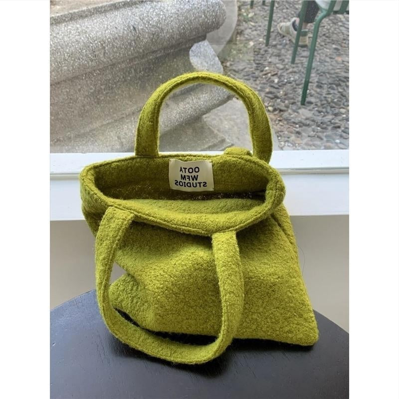mustard green wool material woven handbag