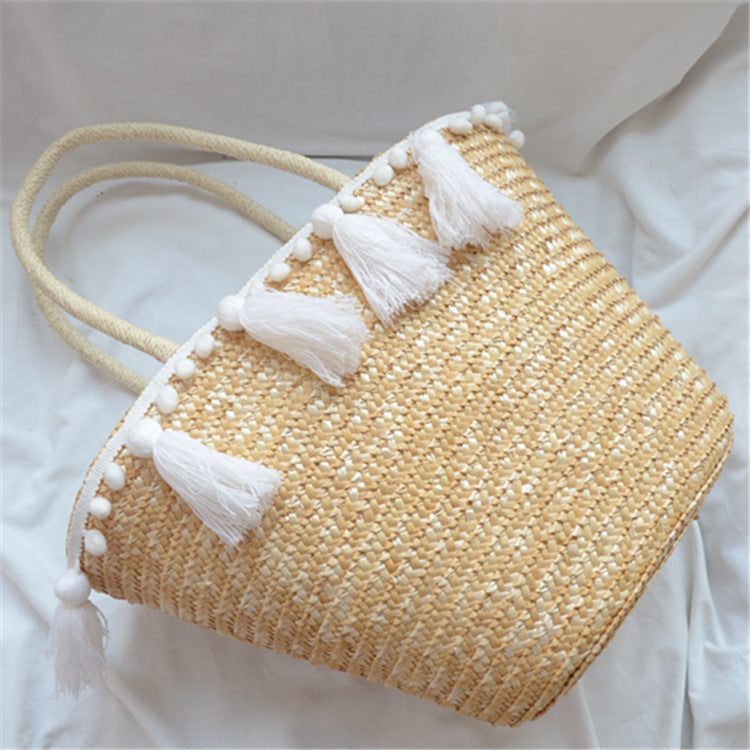 female hand woven tassel shoulder bag