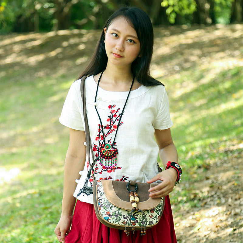 female ethnic style leather messenger dumpling bag