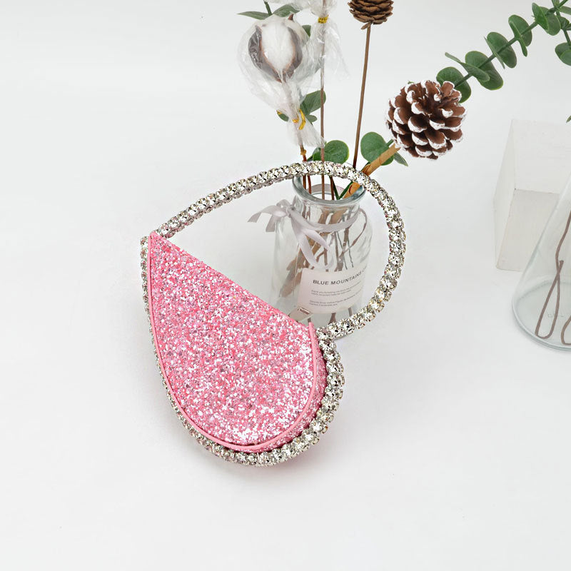 diamond studded dinner bag with diamond heart shaped clutch