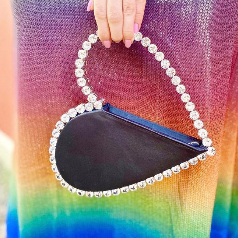 diamond studded dinner bag with diamond heart shaped clutch