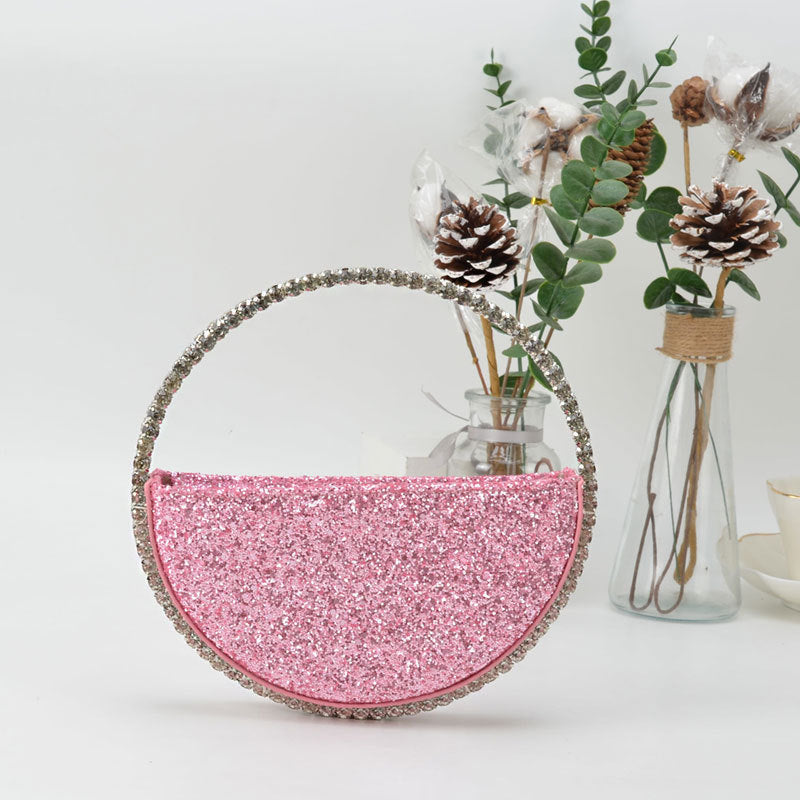 diamond studded dinner bag with diamond heart shaped clutch