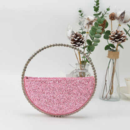 diamond studded dinner bag with diamond heart shaped clutch