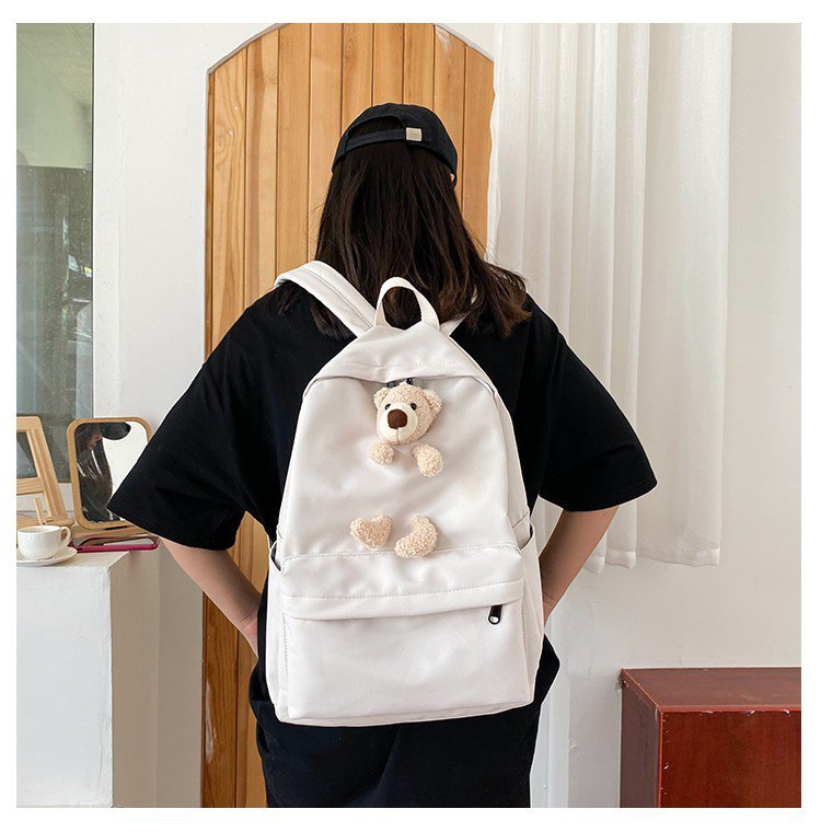 japanese students cartoon bear schoolbag in harajuku