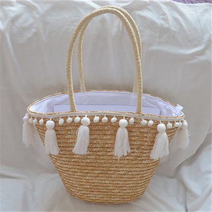 female hand woven tassel shoulder bag