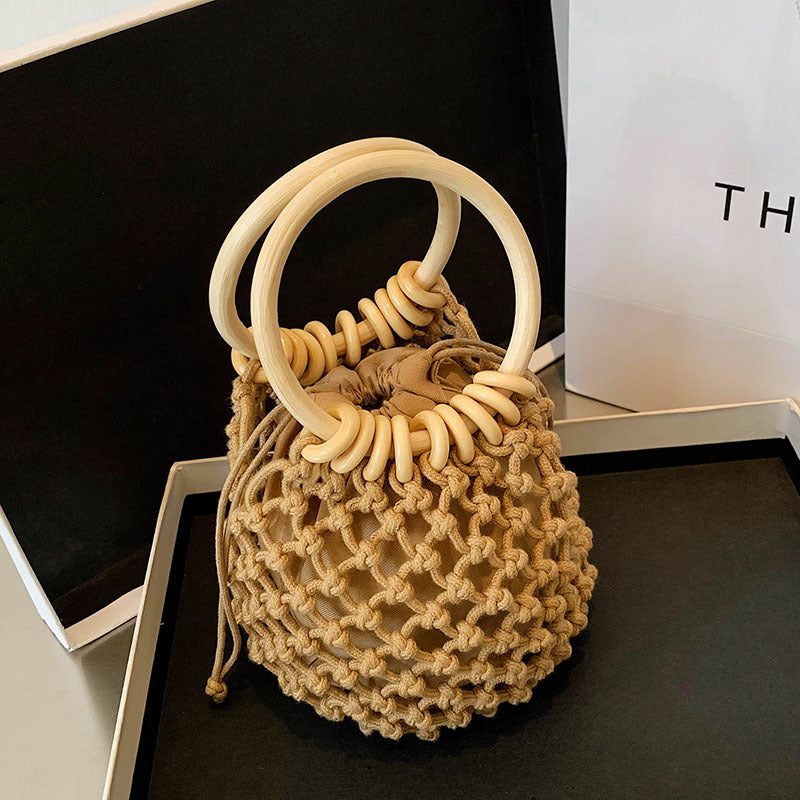 woman-girl-fashion-woven-handbag-beach-style-wood-handle-drawstring-bucket-bag