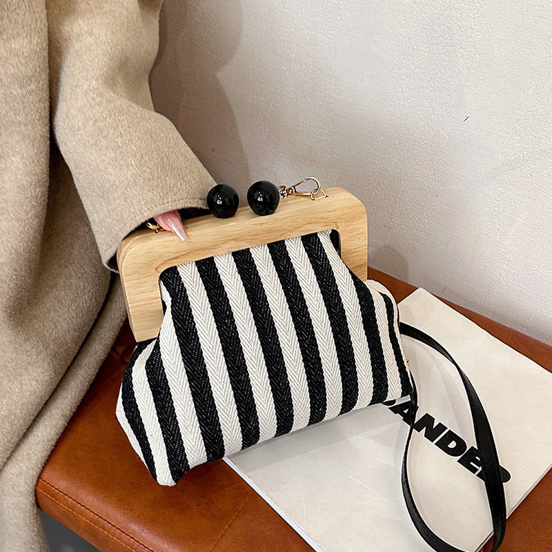 new striped canvas wooden clip mouth clutch