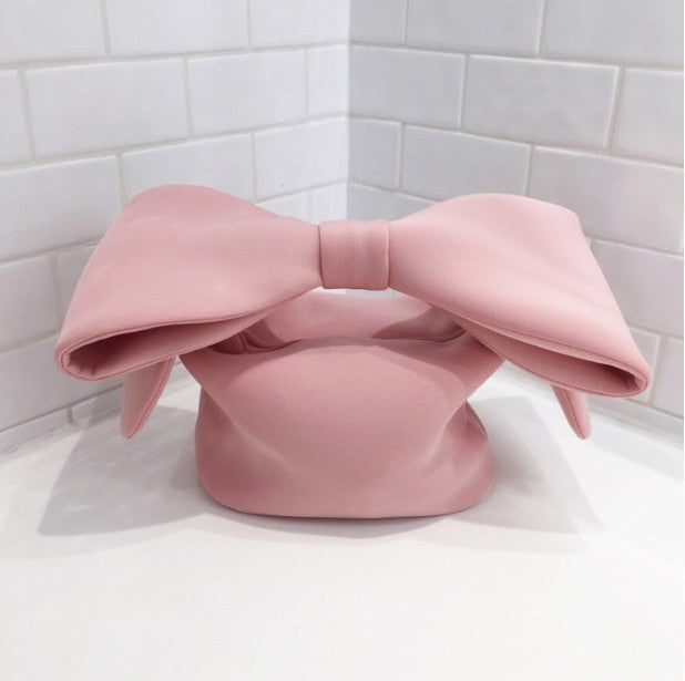 cute bow space cotton hand holding clutch