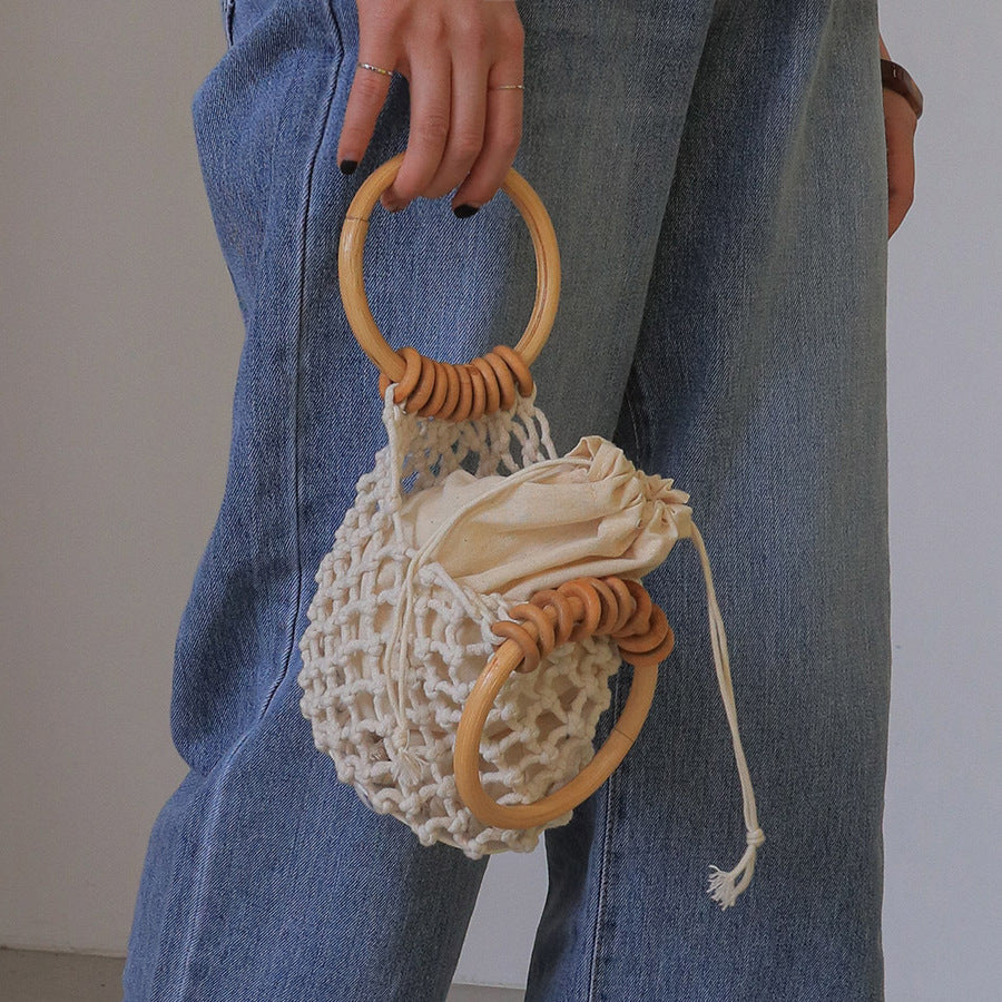 woman-girl-fashion-woven-handbag-beach-style-wood-handle-drawstring-bucket-bag