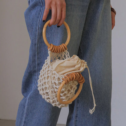 woman-girl-fashion-woven-handbag-beach-style-wood-handle-drawstring-bucket-bag