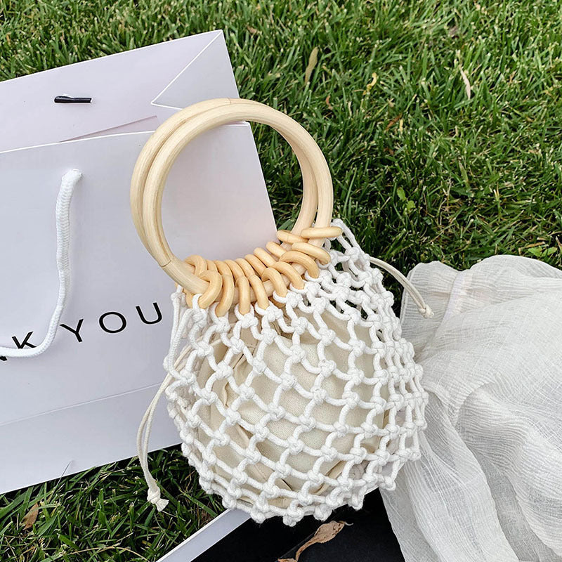 woman-girl-fashion-woven-handbag-beach-style-wood-handle-drawstring-bucket-bag