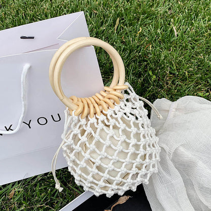 woman-girl-fashion-woven-handbag-beach-style-wood-handle-drawstring-bucket-bag