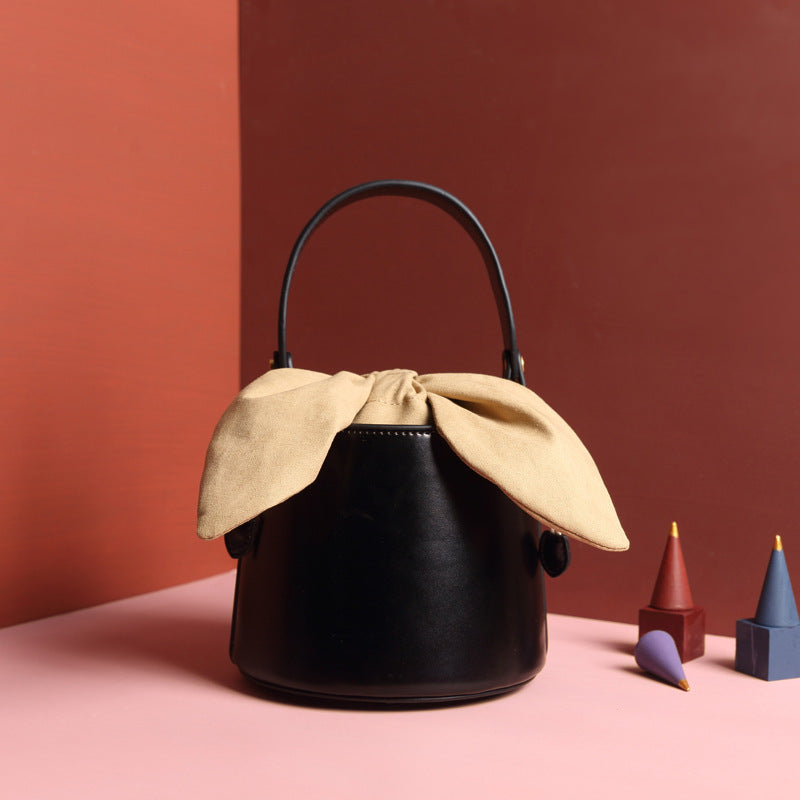 leather bow bucket bag