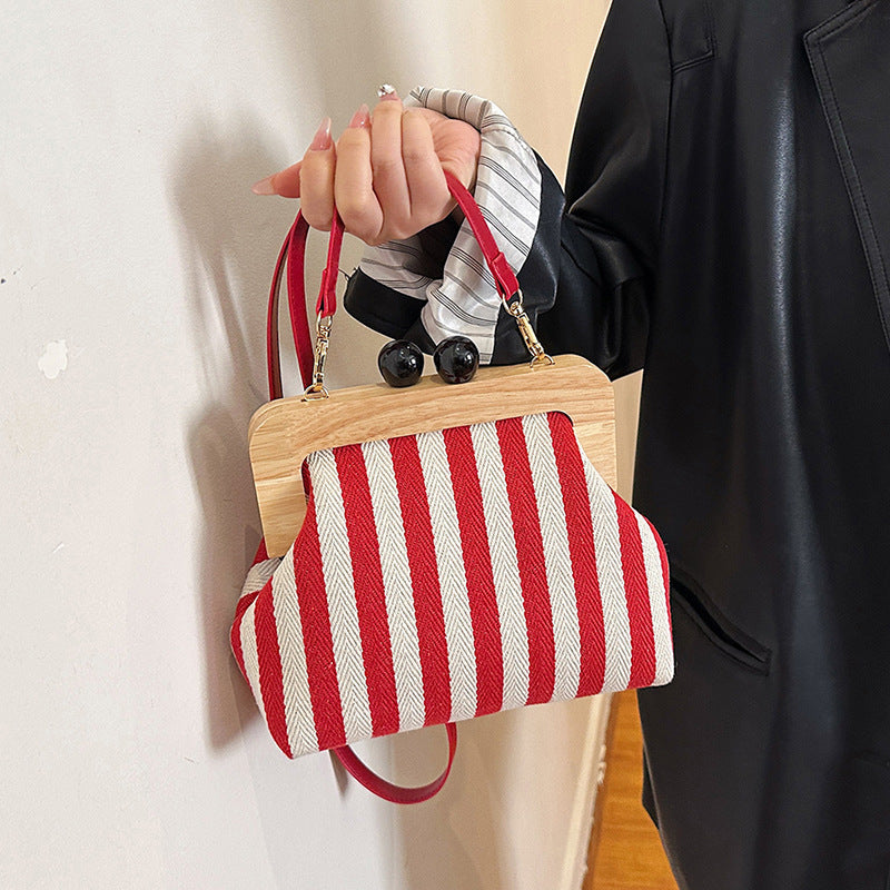 new striped canvas wooden clip mouth clutch