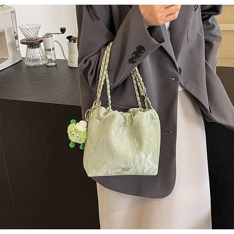 womens hand carrying drawstring pleated bucket bag