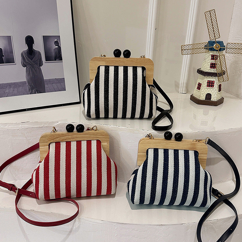 new striped canvas wooden clip mouth clutch