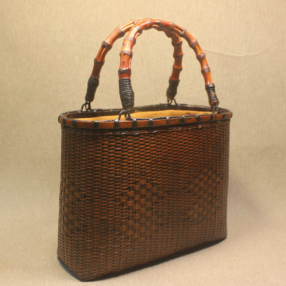 womens hand carrying beach weaving handbag