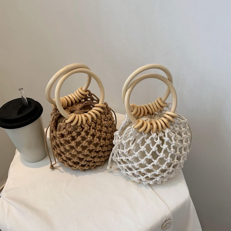 woman-girl-fashion-woven-handbag-beach-style-wood-handle-drawstring-bucket-bag