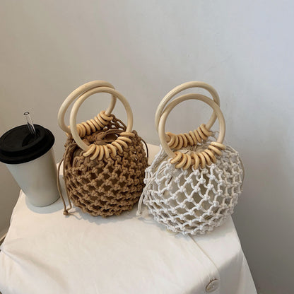 woman-girl-fashion-woven-handbag-beach-style-wood-handle-drawstring-bucket-bag