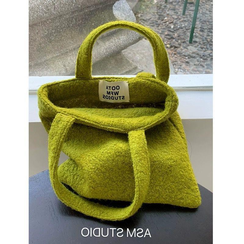 mustard green wool material woven handbag