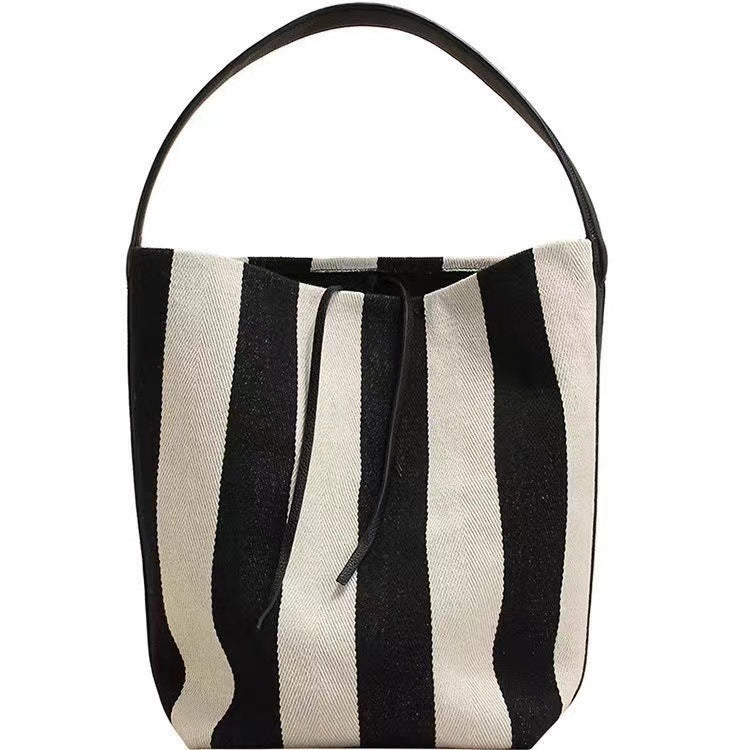 black and white contrast color wide shoulder striped canvas bag