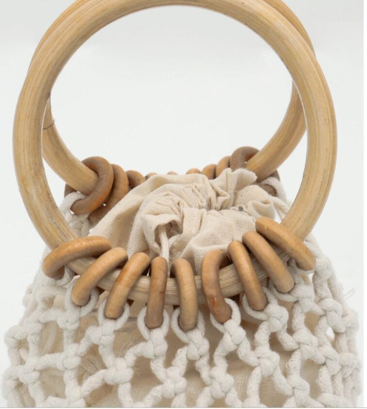 woman-girl-fashion-woven-handbag-beach-style-wood-handle-drawstring-bucket-bag