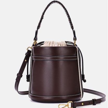 Brown Cylindrical Tote Bag With Dual Handles, Designed For Handheld Or Crossbody Wear