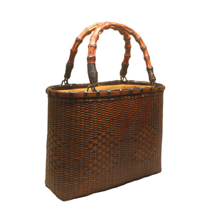 womens hand carrying beach weaving handbag