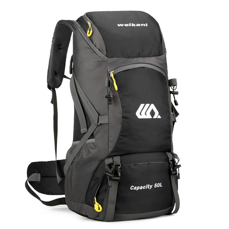 men and women on foot camping bag