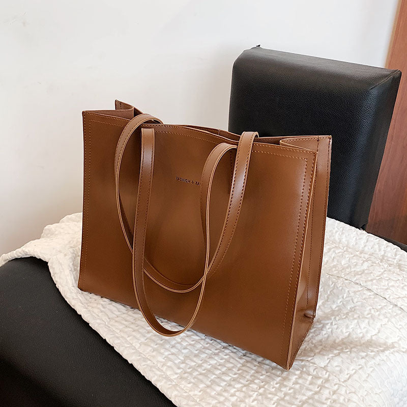 a versatile portable commuter tote bag