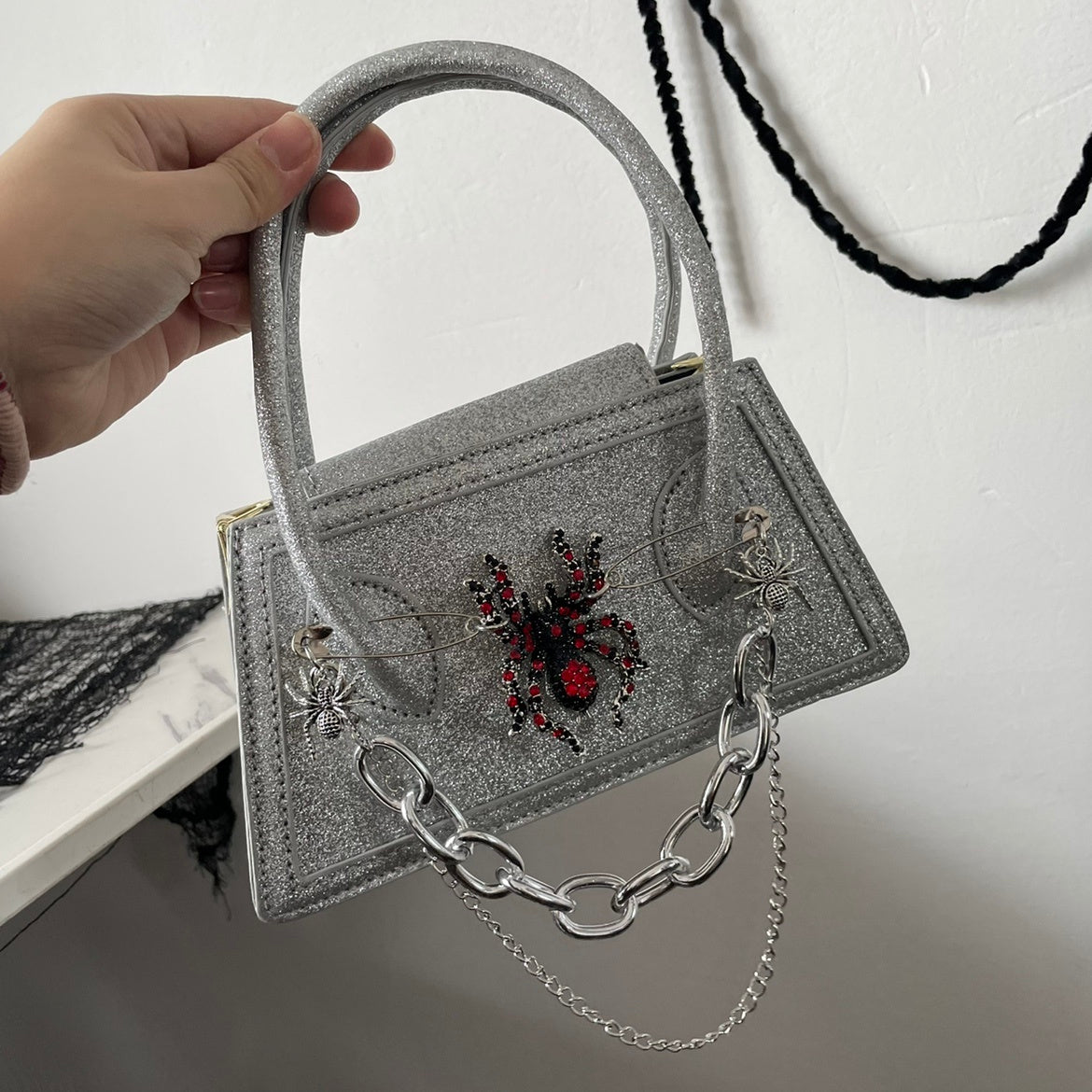 snakeskin spider dark mini crossbody handbag